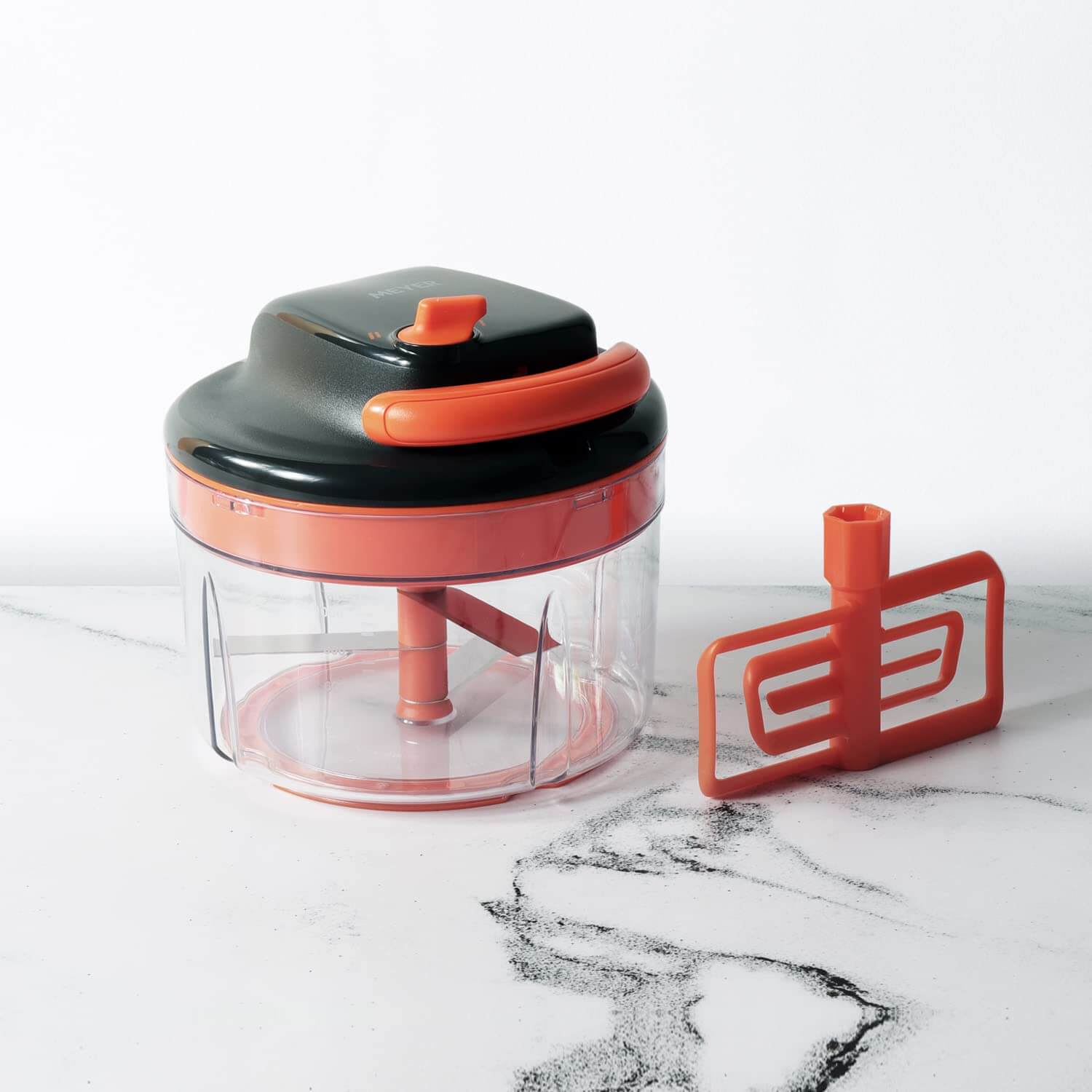 Meyer 2 Speed Pulling Chopper with orange accents and stainless steel blades for efficient vegetable chopping.