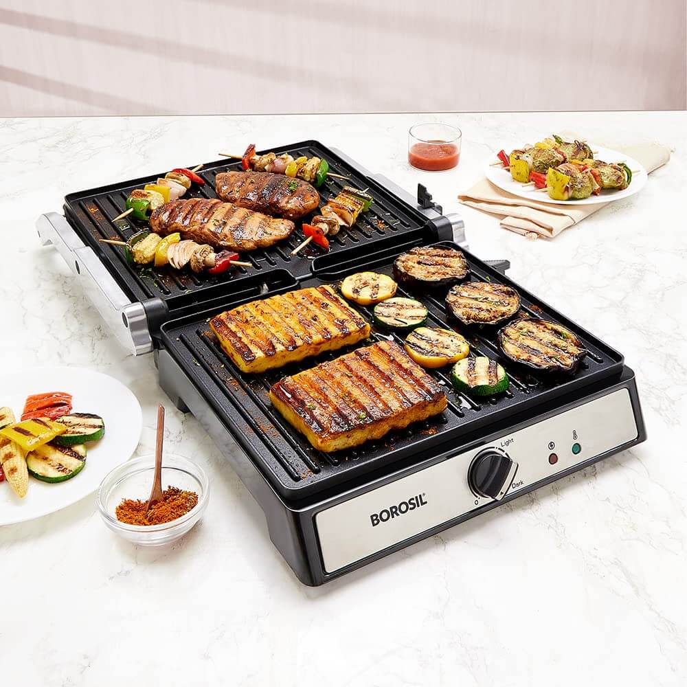 Borosil Super Jumbo 4-Sandwich Grill Maker with grilled meats and vegetables on a marble countertop.