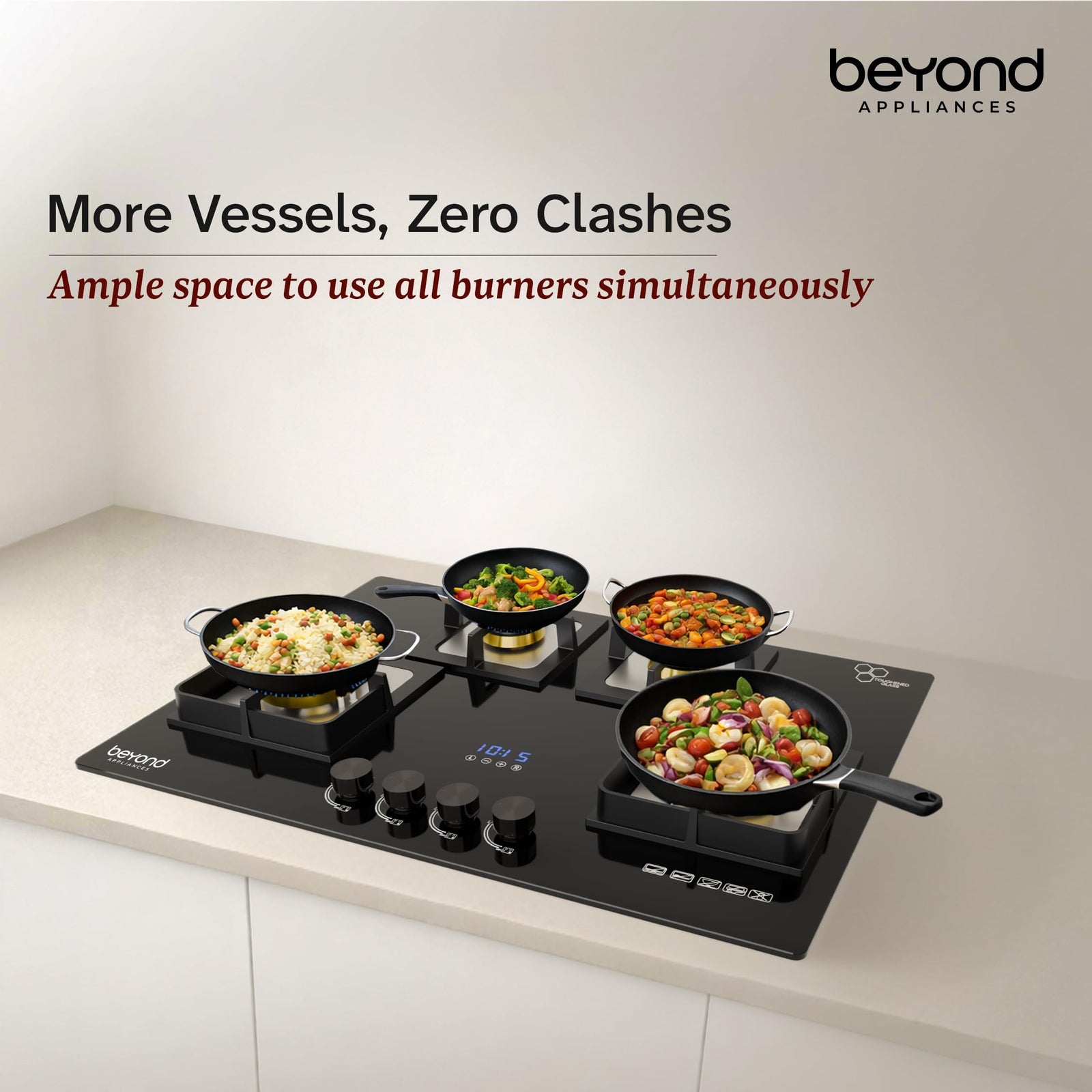 Beyond Dorado hobtop with four pans cooking simultaneously showing ample space between burners