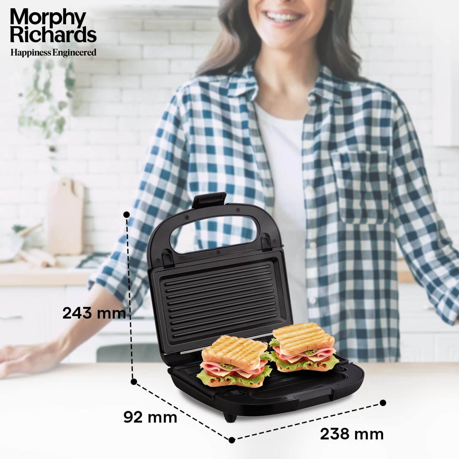 Morphy Richards 750W sandwich maker with two sandwiches, showcasing non-stick grill plates in a modern kitchen.