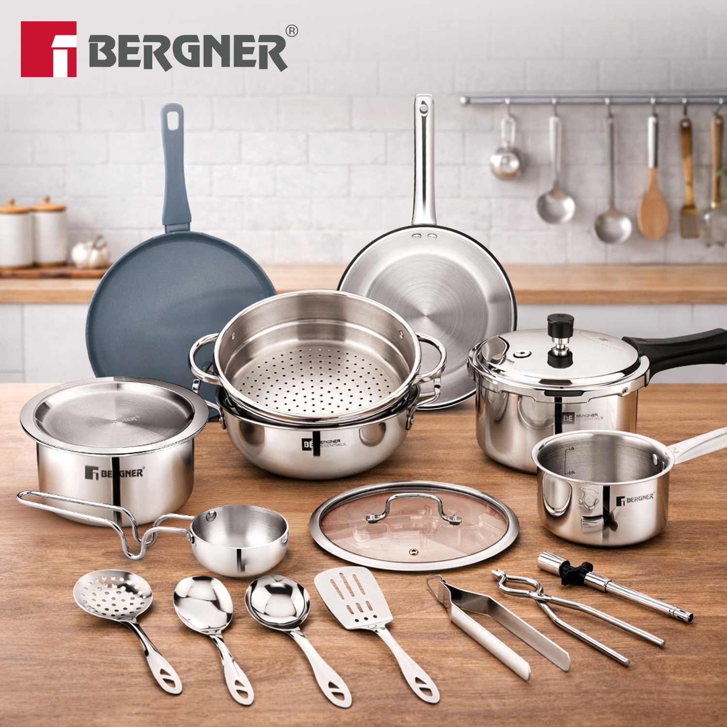 Bergner 17 piece tri-ply stainless steel cookware gift set laid out on a kitchen counter