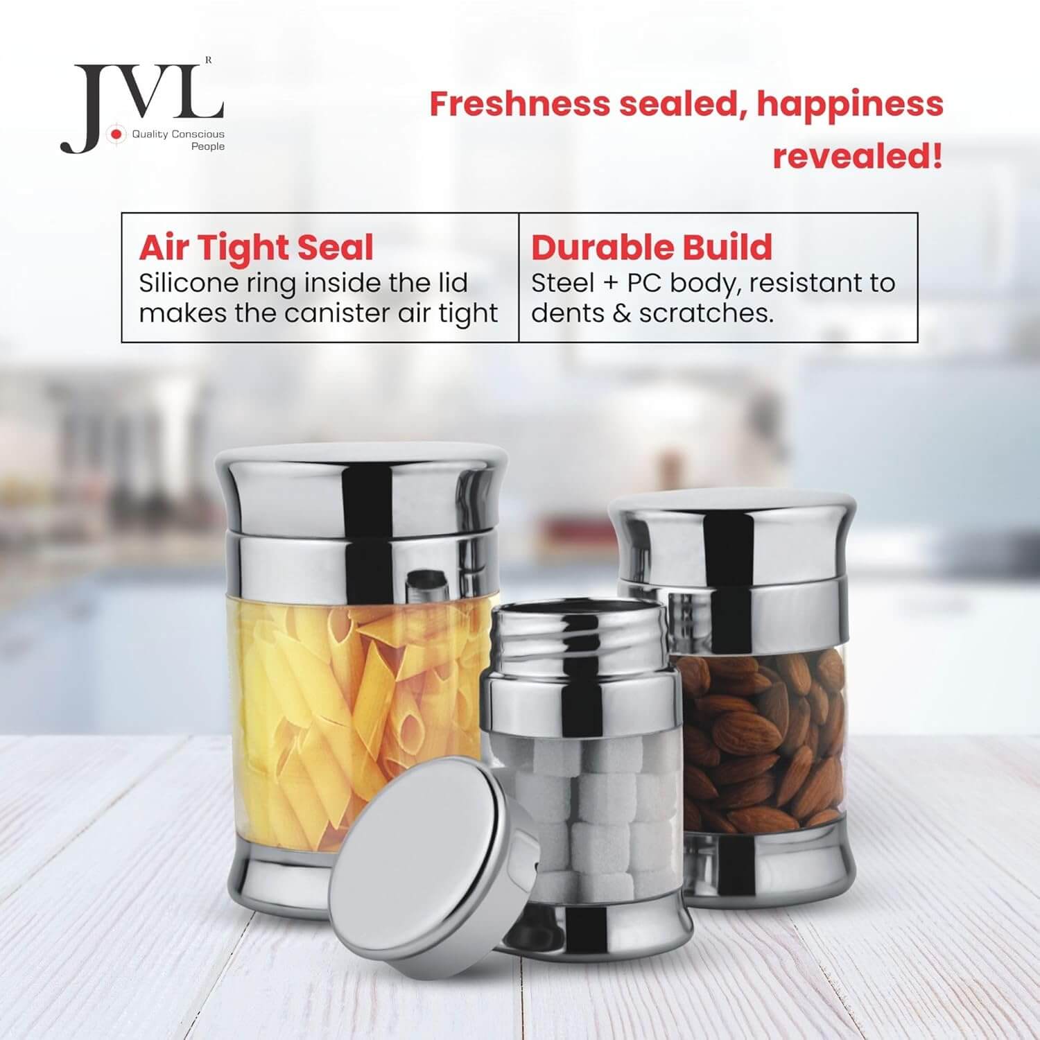 JVL steel canisters with food contents on a light surface, featuring JVL branding and product features.