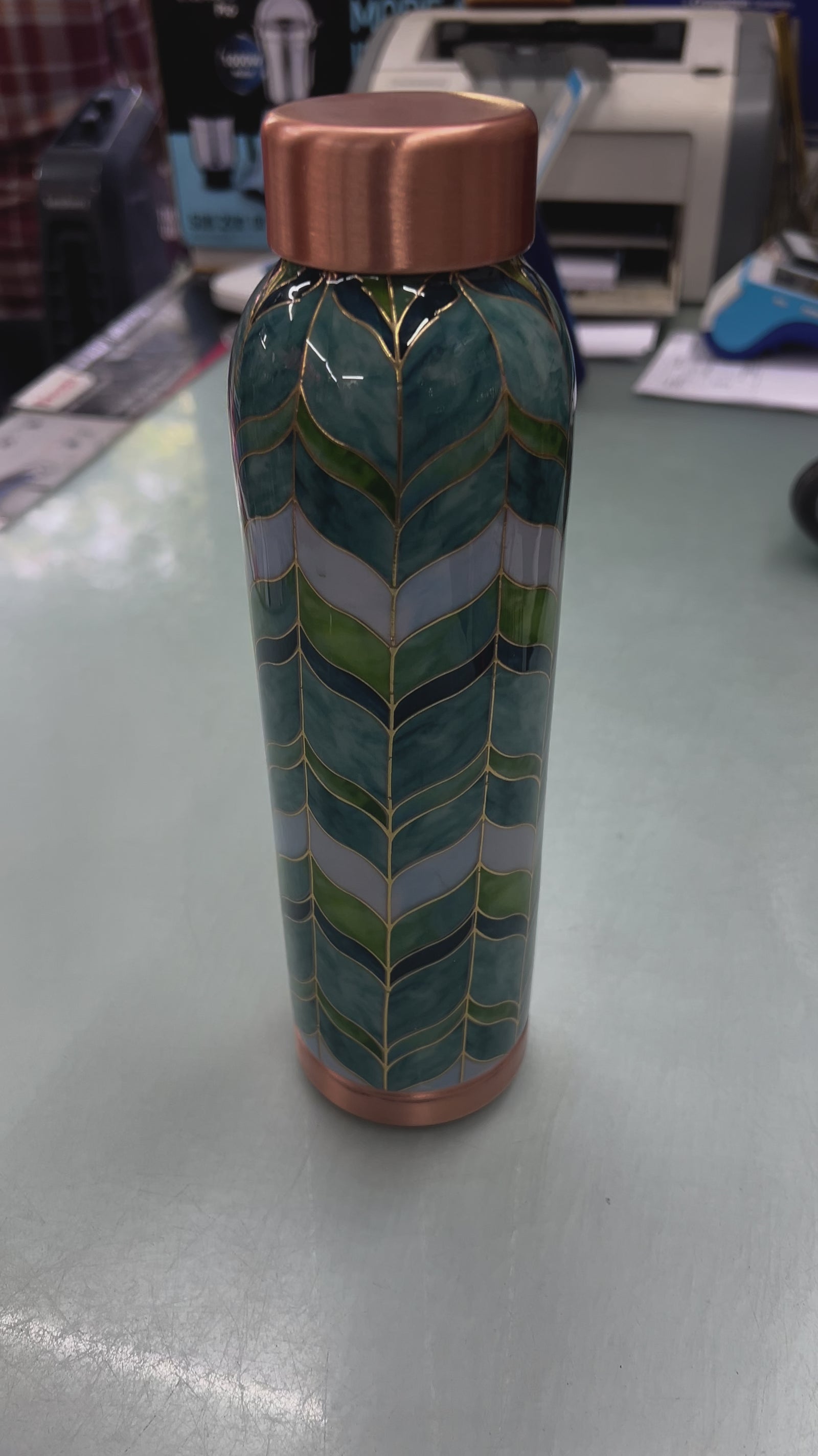 Attro handcrafted copper water bottle with green leaf patterns