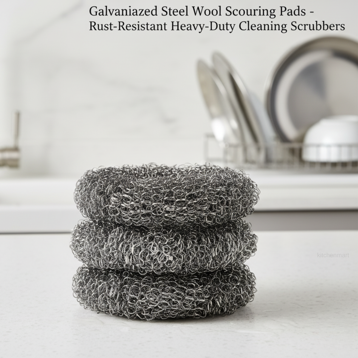 Stack of galvanized steel wool scouring pads on a kitchen counter with a dish rack in the background.
