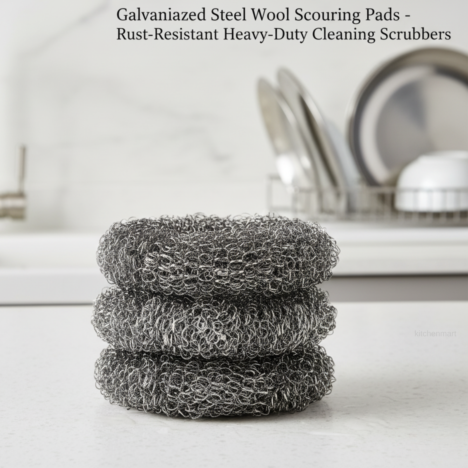 Stack of galvanized steel wool scouring pads on a kitchen counter with a dish rack in the background.