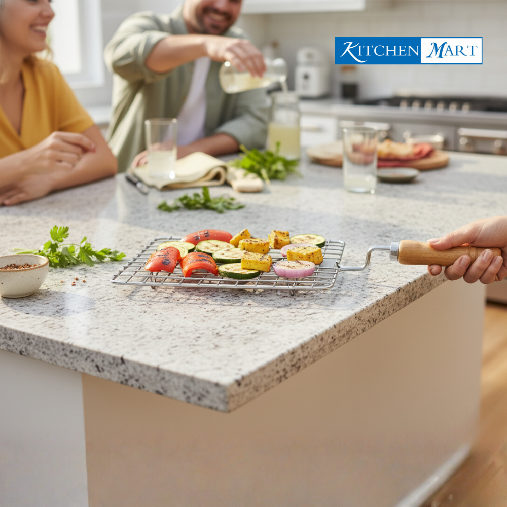 Kitchen Mart square stainless steel papad roaster with wooden handle on white background