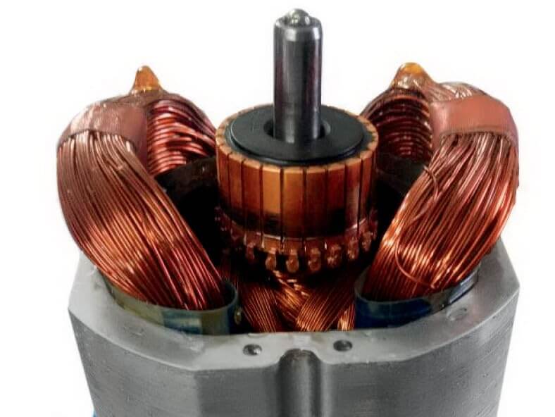 Close-up view of a powerful copper motor with winding and bearings used in high-performance appliances.