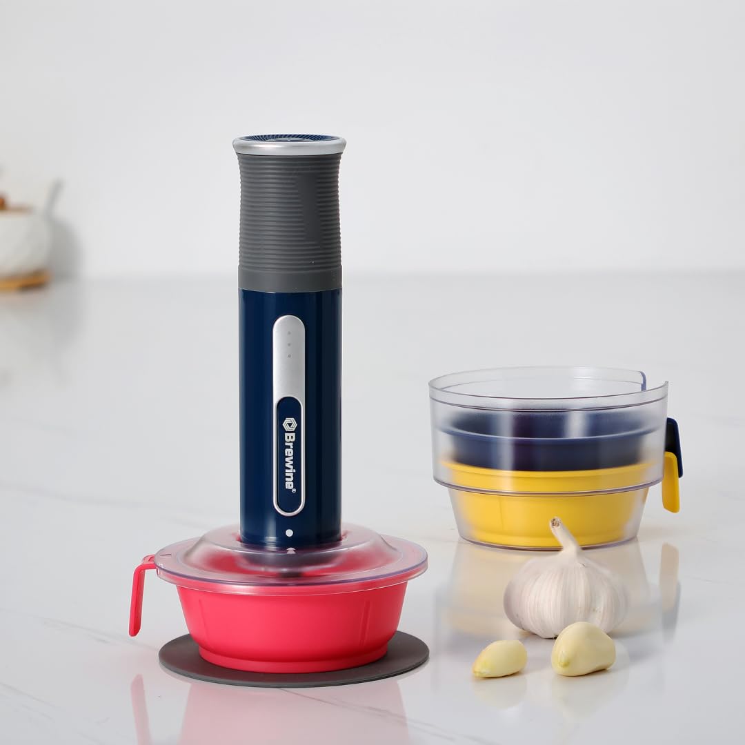 Cordless garlic chopper complete set showing main unit three colored mini bowls accessories blades and garlic peeler with charging specifications