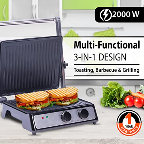 Multi-functional 3-in-1 grill with sandwiches being cooked, surrounded by ingredients on a kitchen counter.