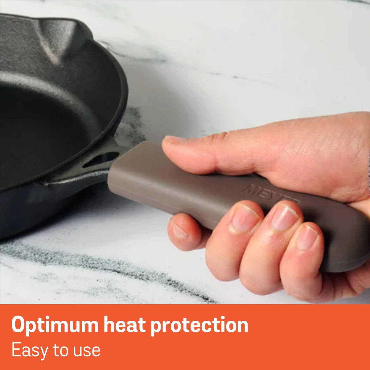 Brown Meyer handle holder protecting hands from hot cookware