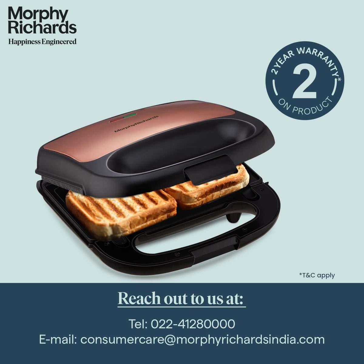Morphy Richards Luxe Rose Gold 2-in-1 sandwich maker with grilled sandwiches, showcasing the product's warranty.
