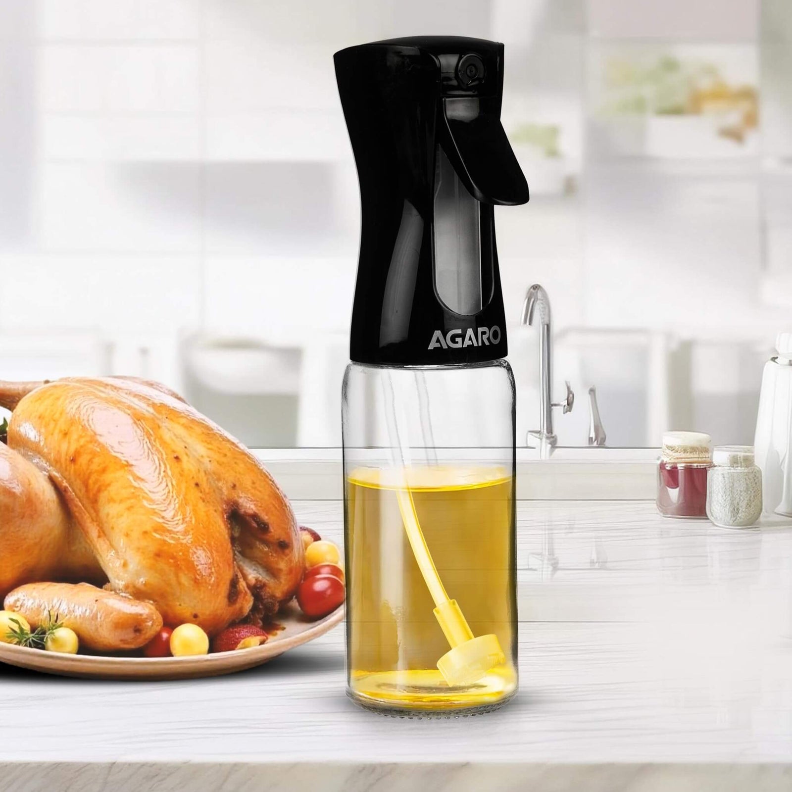 agaro elegant oil Spray bottle with oil next to a roasted turkey on a kitchen counter