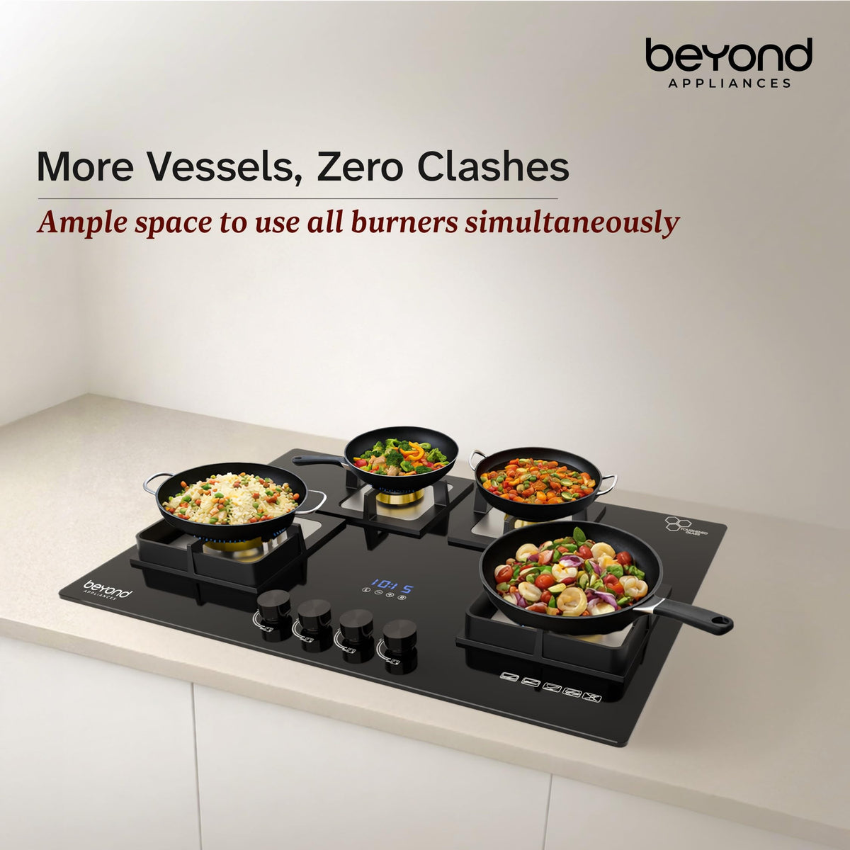 Beyond Dorado hobtop with four pans cooking simultaneously showing ample space between burners