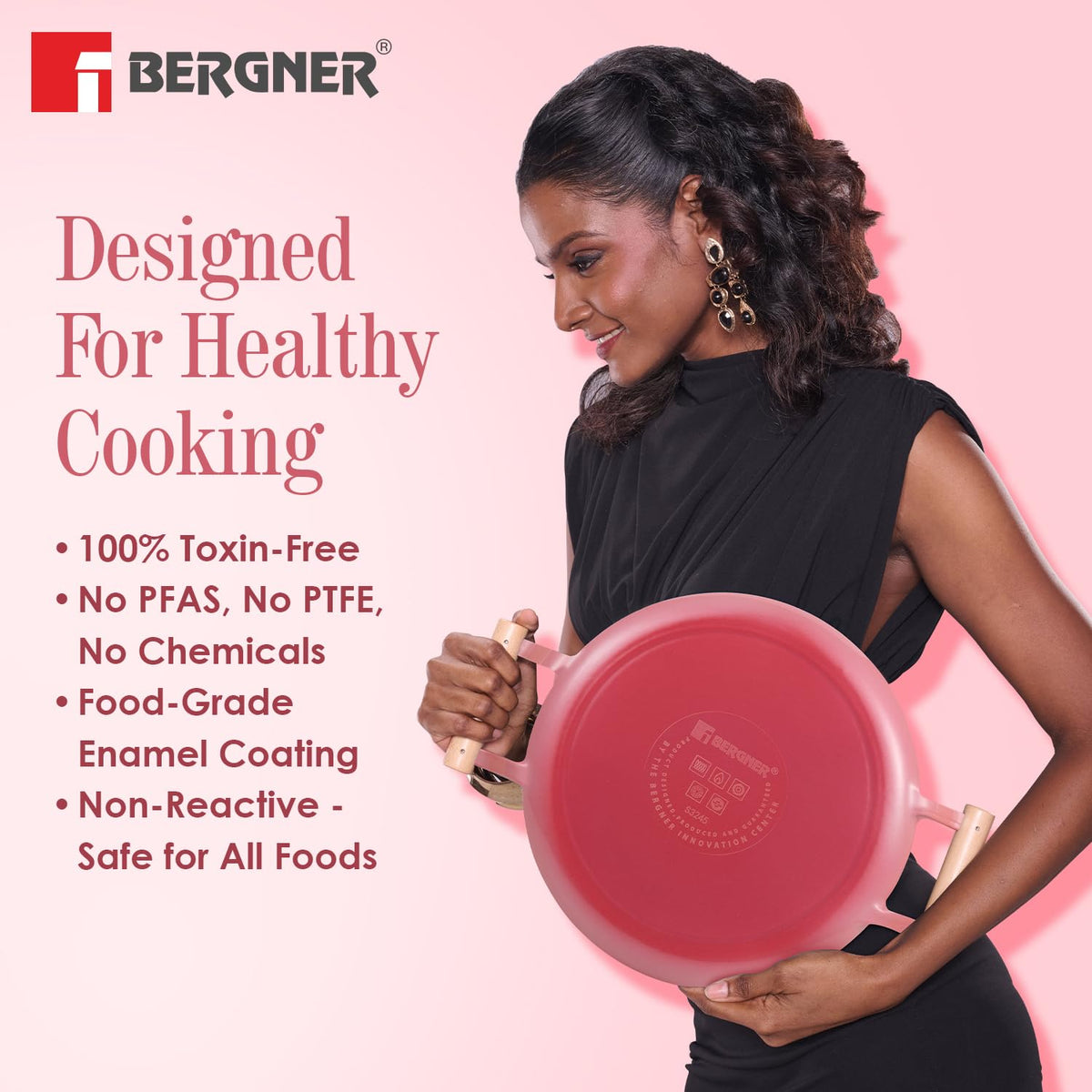 Woman holding a red frying pan with Bergner branding and text about healthy cooking on a pink background