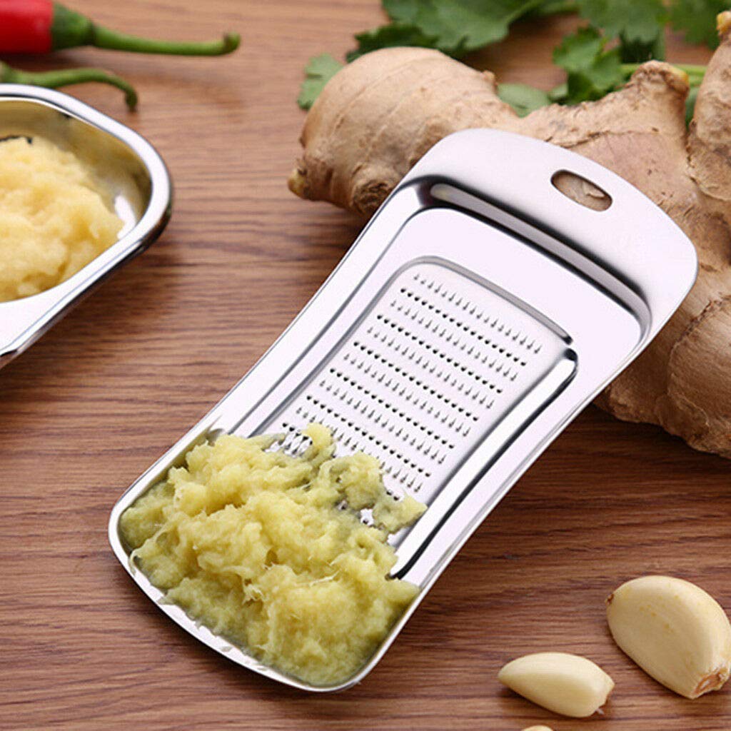 Kitchen Mart stainless steel grater zester for garlic ginger and vegetables 13.8cm compact design