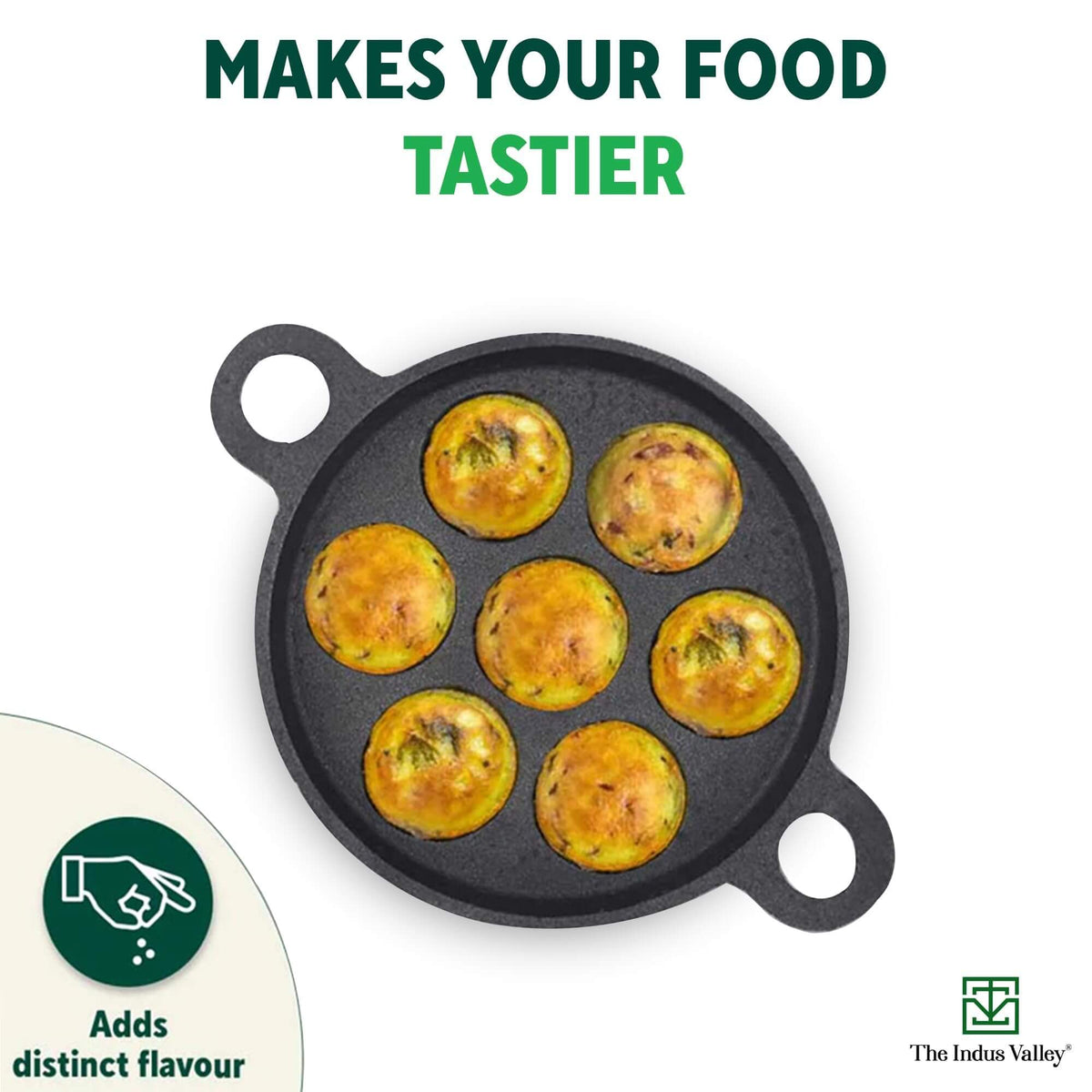 Indus Valley cast iron paniyaram pan with six deliciously cooked paniyarams, enhancing flavor and nutrition.