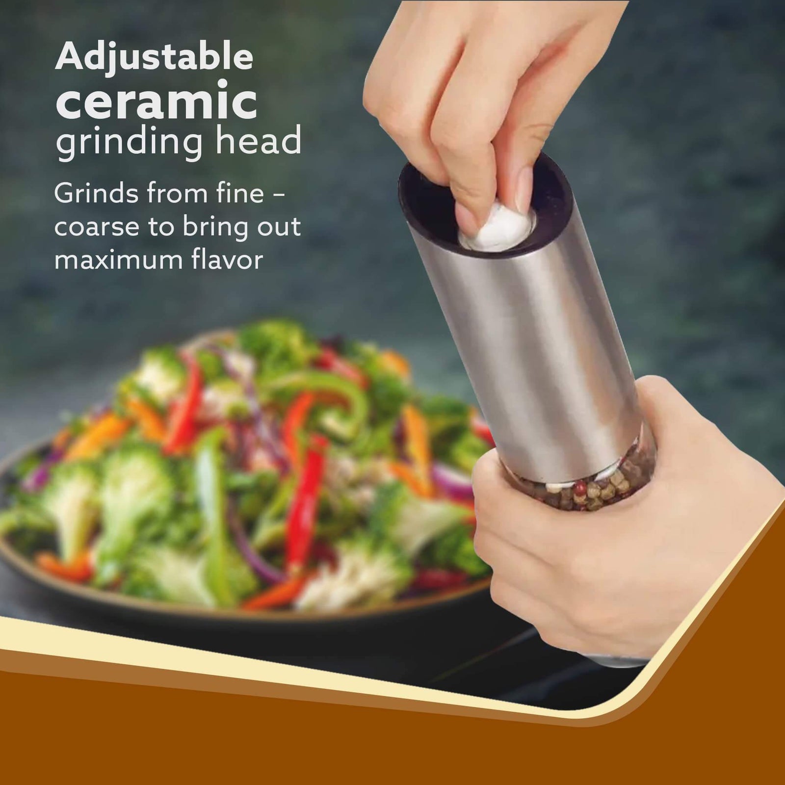 Hand using a pepper grinder with a salad in the background, highlighting adjustable ceramic grinding head feature.