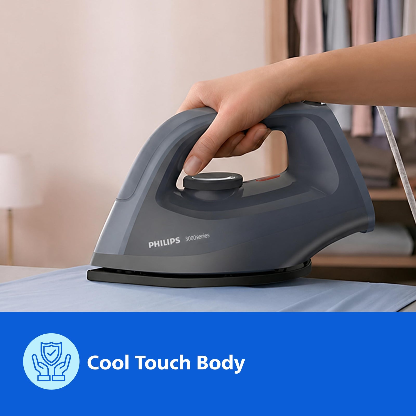 Philips DST0700/00 dry iron pressing a cotton shirt on an ironing board
