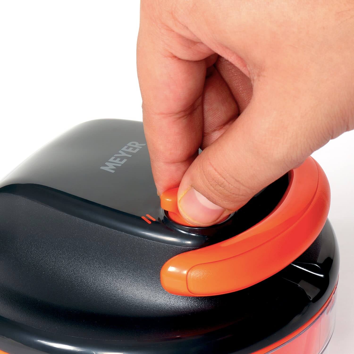 Person adjusting the speed setting on the Meyer 2 Speed Pulling Chopper, designed for efficient vegetable chopping.