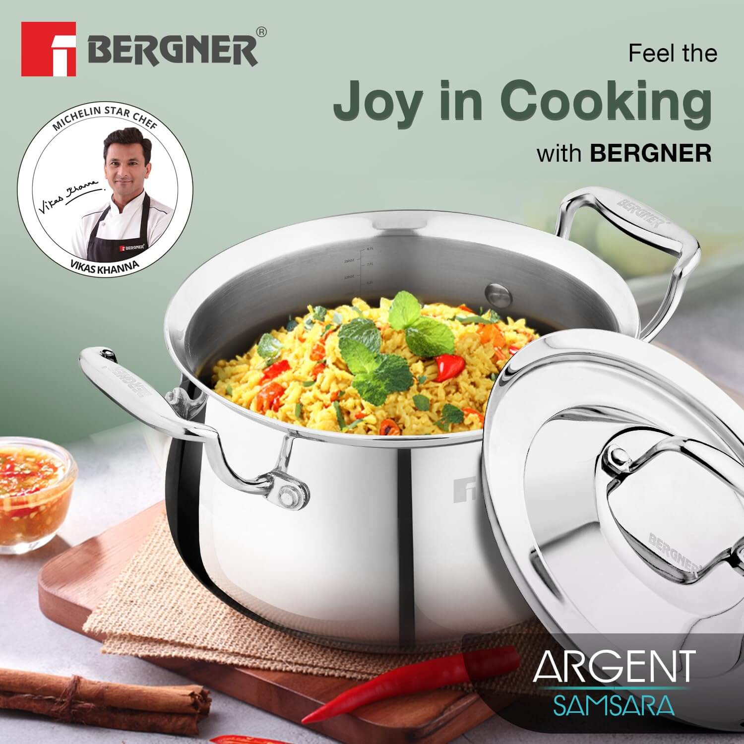 Bergner Argent Samsara Triply Stainless Steel Biryani Handi with lid, showcasing vibrant biryani and herbs.