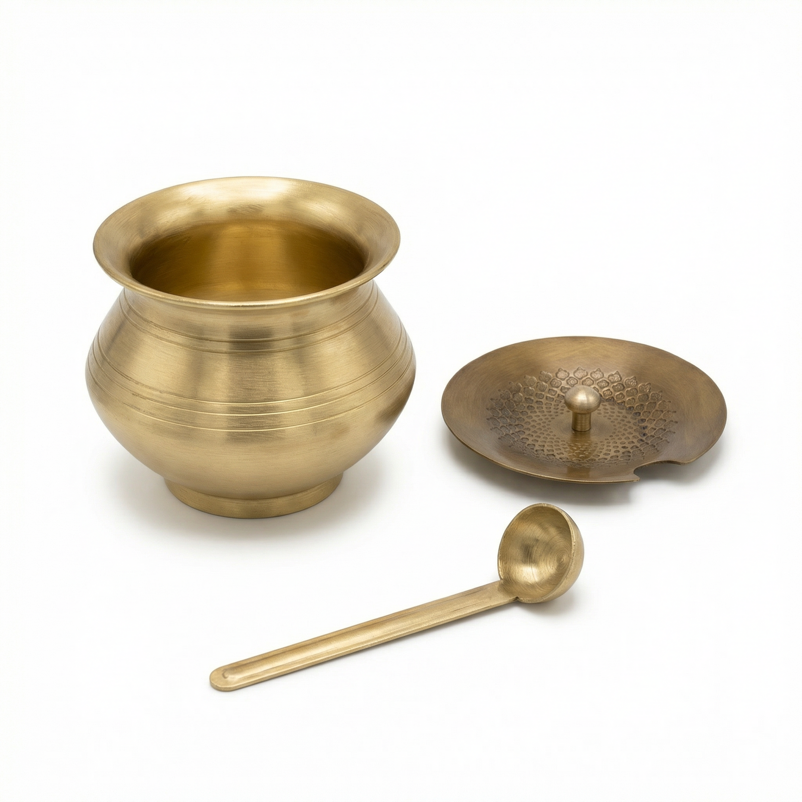 Kitchen Mart brass ghee pot 400 ml with hammered lid and brass spoon on white background