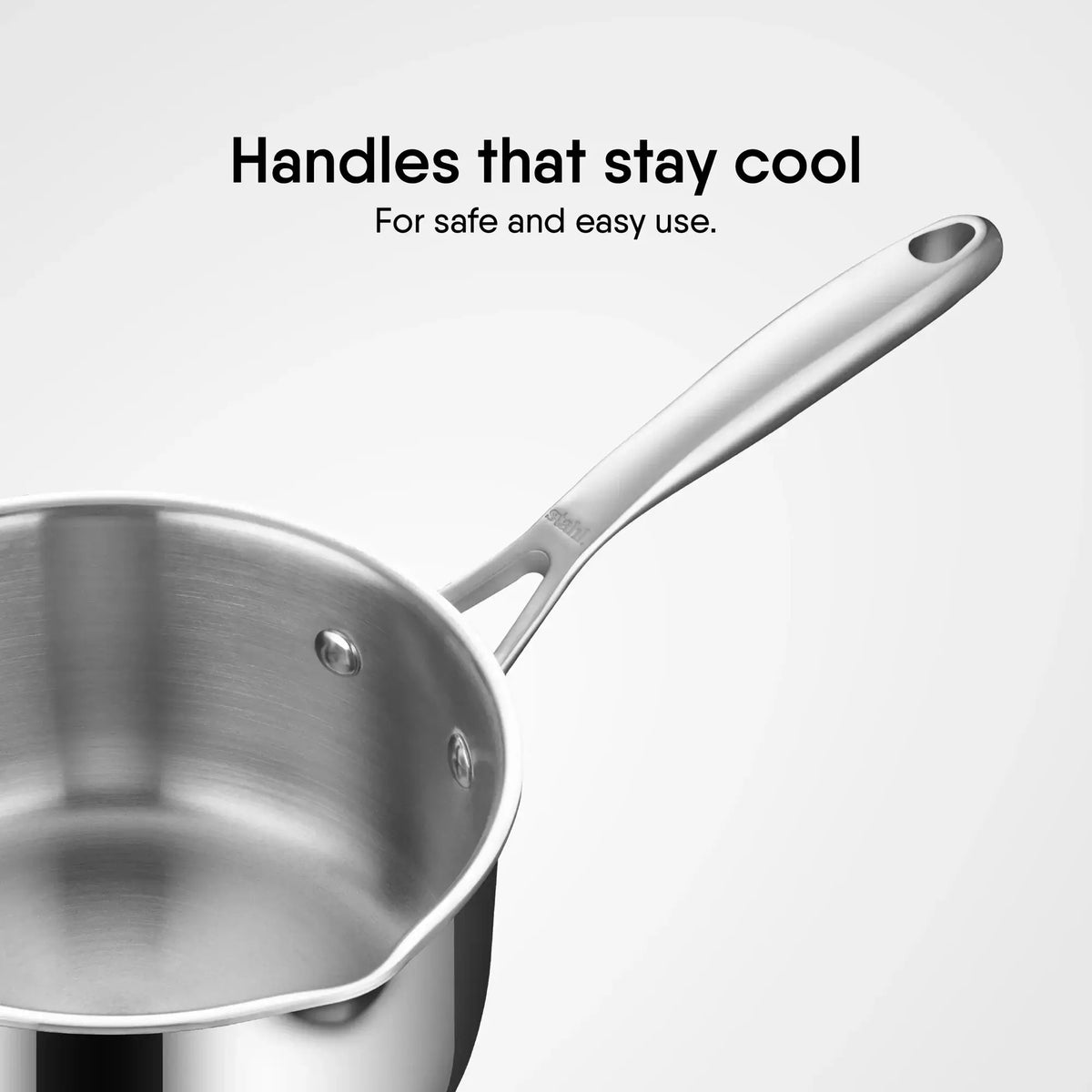 Close-up of Stahl Artisan Triply Saucepan handle designed to stay cool for safe and easy use.