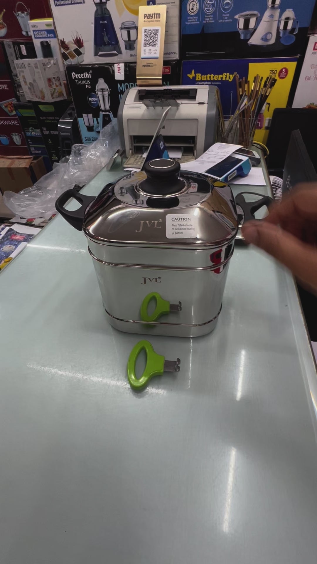 JVL Square Idly Maker with 5 plates and induction-compatible base, showcased with vibrant green handles.
